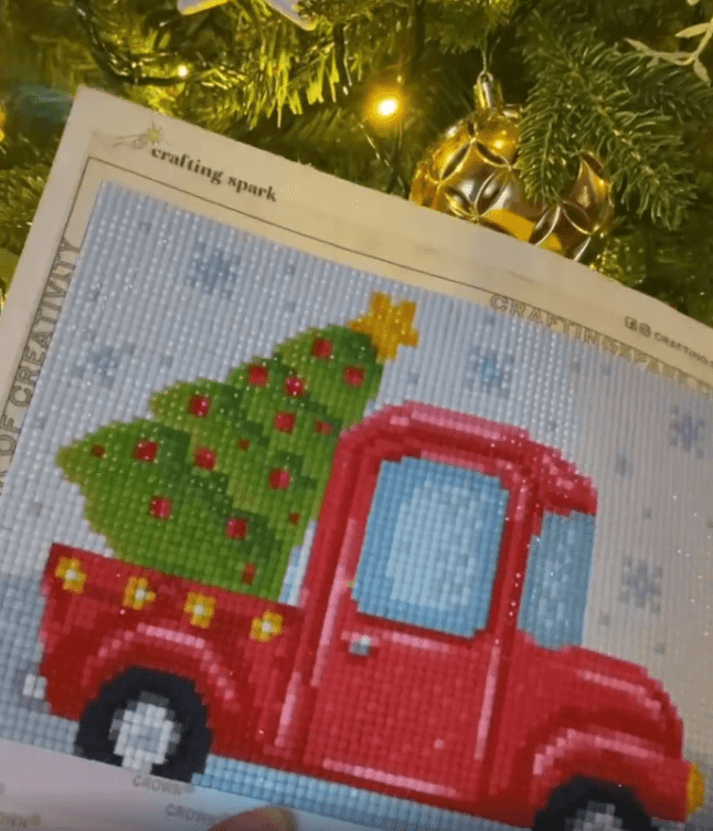 New Year Lorry CS2693 diamond painting kit with tools and pre-sorted acrylic diamonds, showcasing vibrant colors and detailed design.